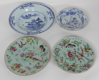 Lot 245 - Two Chinese celadon plates; together with two...