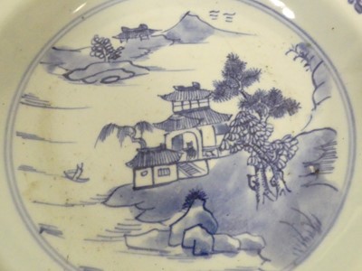 Lot 245 - Two Chinese celadon plates; together with two...
