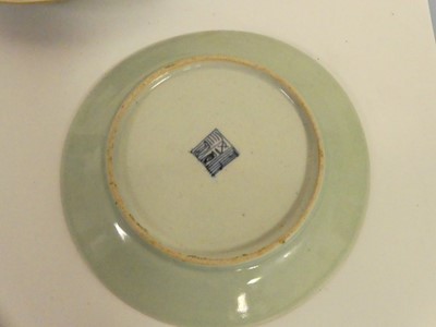 Lot 245 - Two Chinese celadon plates; together with two...