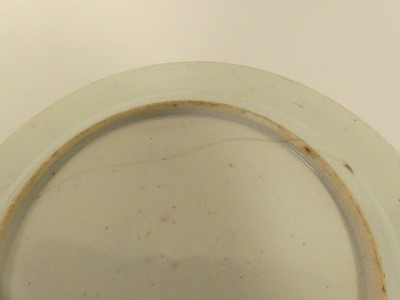 Lot 245 - Two Chinese celadon plates; together with two...