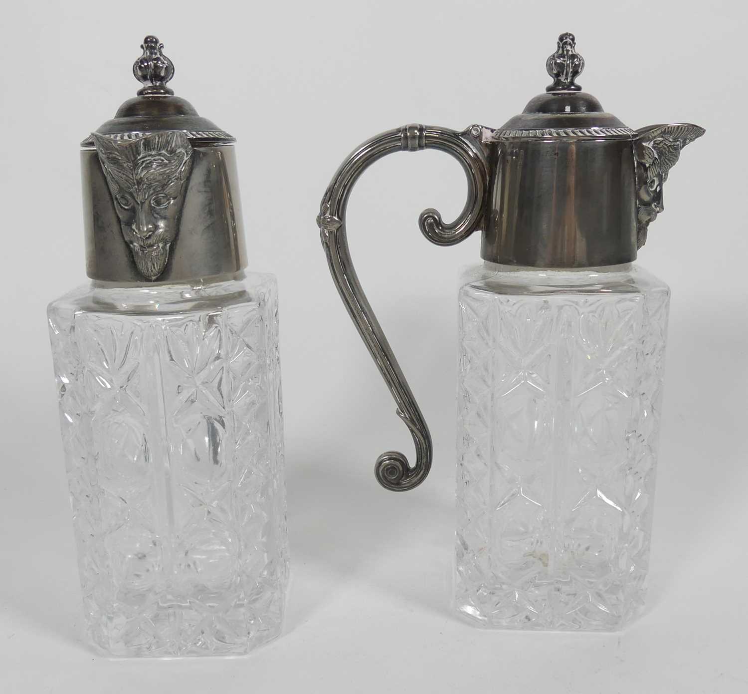Lot 266 - A pair of silver plated and glass claret jugs,...