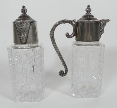 Lot 266 - A pair of silver plated and glass claret jugs,...