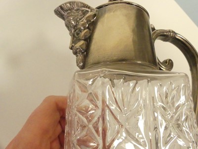 Lot 266 - A pair of silver plated and glass claret jugs,...