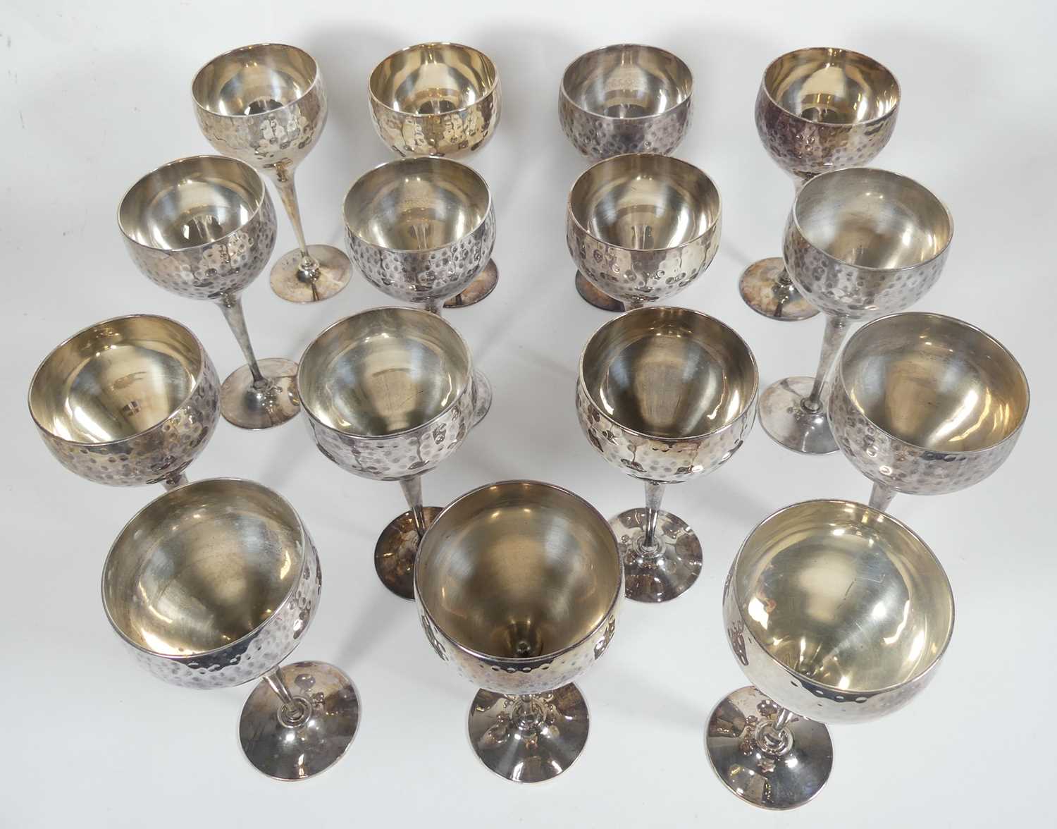 Lot 267 - Fifteen silver toned metal goblets, with...