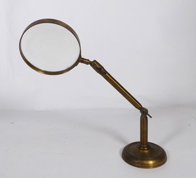 Lot 543 - A table-top adjustable magnifying lens, brass...