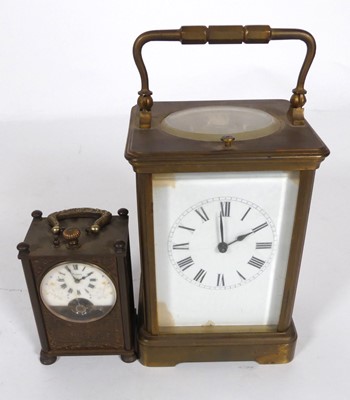 Lot 545 - A lacquered brass carriage clock, with push...