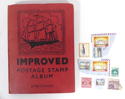 Lot 551 - A stamp album and contents, to include...