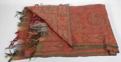 Lot 588 - A Persian embroidered throw with tasselled edges