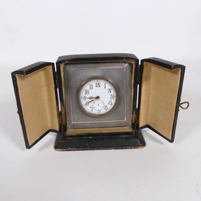 Lot 500 - An Art Deco silver clad desk clock, in black...