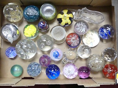 Lot 622 - A collection of glass paperweights, to include...