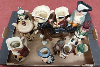 Lot 638 - A collection of Toby jugs, to include examples...