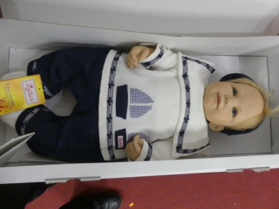 Lot 674 - A Sigikid boxed toy doll; together with a...