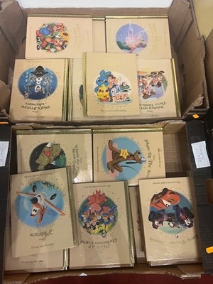 Lot 684 - Two boxes of Disney books relating to cartoons,...