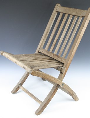 Lot 729 - A folding garden seat of slatted teak...