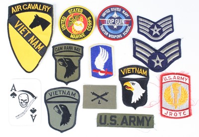 Lot 745 - A collection of cloth badges to include Viet...