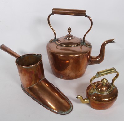 Lot 595 - A large copper kettle together with a smaller...