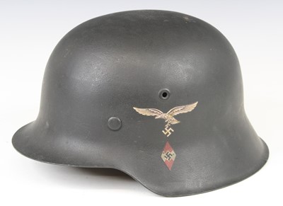 Lot 730 - A German M1935 steel helmet with Luftwaffe...