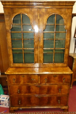 Lot 1282 - A Queen Anne style oyster veneered bookcase on...