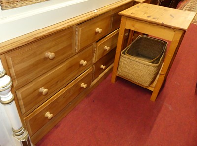 Lot 1196 - A modern pine low chest, of seven drawers,...