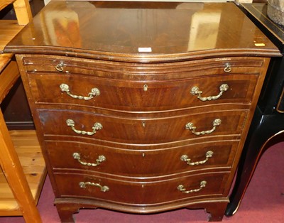 Lot 1200 - A Georgian style mahogany serpentine chest,...