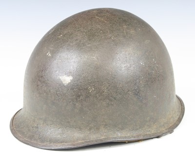 Lot 673 - An American M1 steel combat helmet, having a...