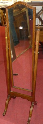 Lot 1327 - An oak cheval mirror, width 42cm