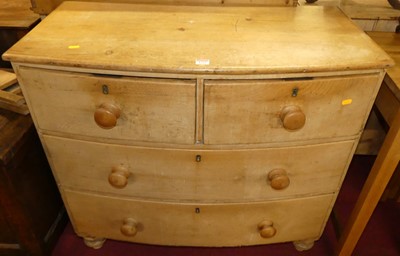 Lot 1235 - An early 19th century pine bowfront chest, of...