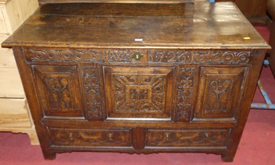 Lot 1342 - A circa 1700 joined oak three-panel mule chest...