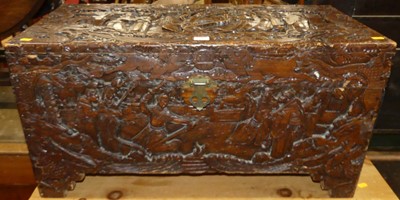 Lot 1343 - An eastern carved camphorwood blanket box,...