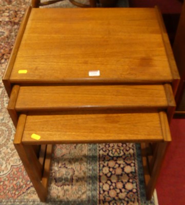 Lot 1254 - A G-Plan teak nest of three occasional tables,...