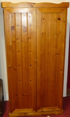 Lot 1283 - A modern pine double door wardrobe, width 92cm