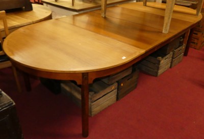 Lot 1280 - A 1970s teak extending dining table having two...