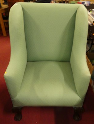 Lot 1292 - A Georgian style walnut framed wing armchair,...