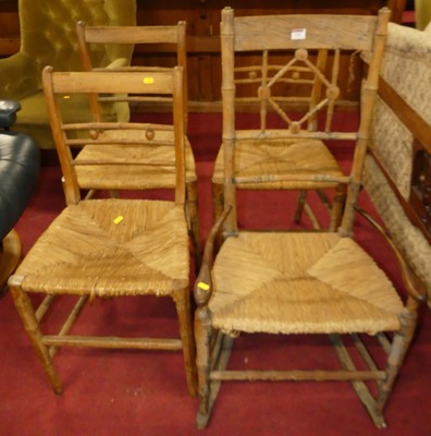 Lot 1319 - A Victorian ash and rush seat elbow chair on...