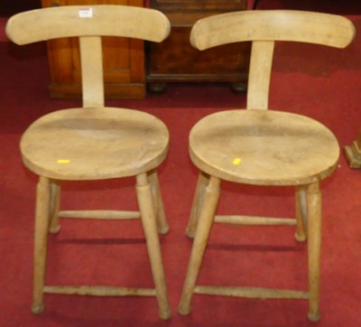 Lot 1320 - A pair of elm seat and beech wood stools