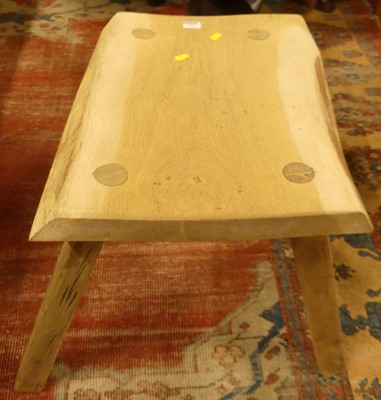 Lot 1301 - A primitive scrubbed oak stool, width 52cm