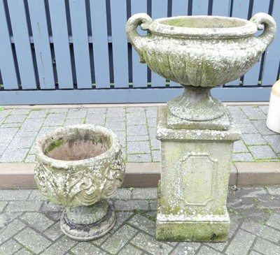 Lot 1349 - A reconstituted stone garden urn on stand, and...