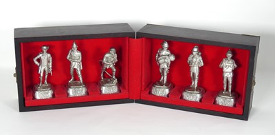 Lot 129a - A set of six cast pewter figures of firemen,...