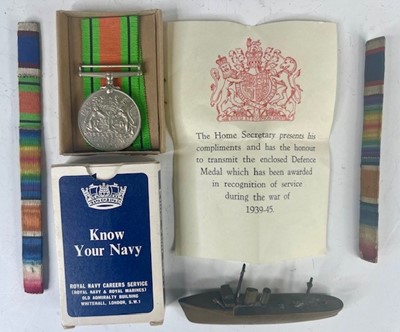 Lot 779 - A WWII Defence medal, with entitlement slip,...