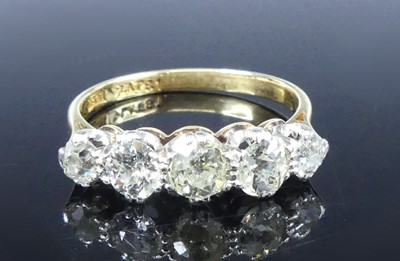 Lot A yellow and white metal diamond half-hoop...