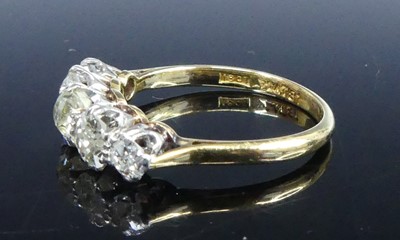 Lot A yellow and white metal diamond half-hoop...