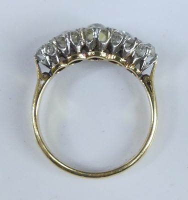 Lot A yellow and white metal diamond half-hoop...