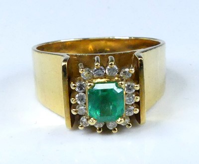 Lot 2563 - A yellow metal, emerald and diamond...