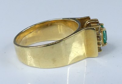 Lot 2563 - A yellow metal, emerald and diamond...