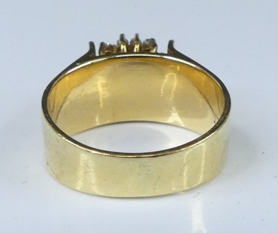 Lot 2563 - A yellow metal, emerald and diamond...