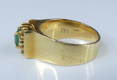 Lot 2563 - A yellow metal, emerald and diamond...