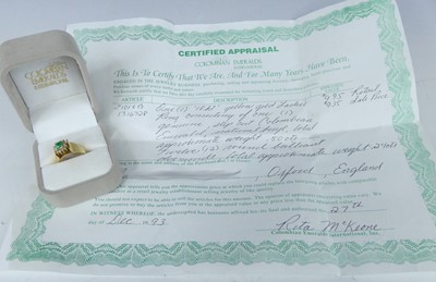 Lot 2563 - A yellow metal, emerald and diamond...