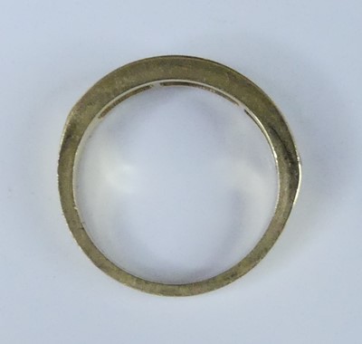 Lot 2549 - A yellow metal diamond half eternity ring,...