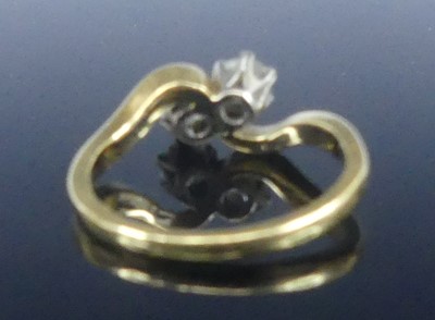 Lot 2566 - An 18ct yellow and white gold diamond...