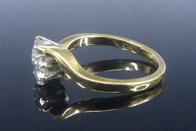 Lot 2566 - An 18ct yellow and white gold diamond...